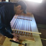 玄関の戸を製作しています。 下條村 丸正木工所